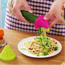 Manual carrot julienne shredder tool making thin vegetable strips on a cutting board